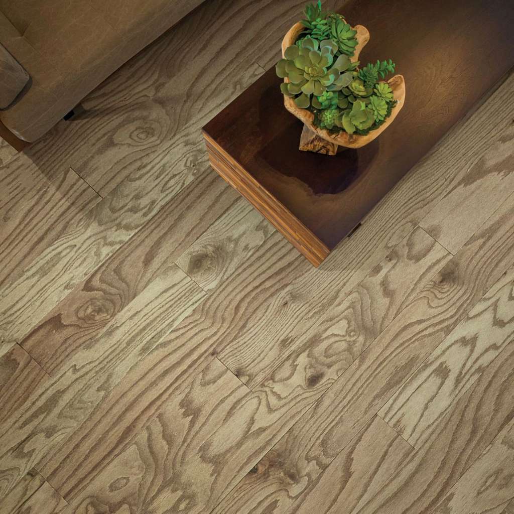 Eclectic Oak by Shaw Floors features the distinctive graining and detail of red oak hardwood. Pillowed edges and ends give each plank a more pronounced sculpted effect, which enhances the versatile vintage look.