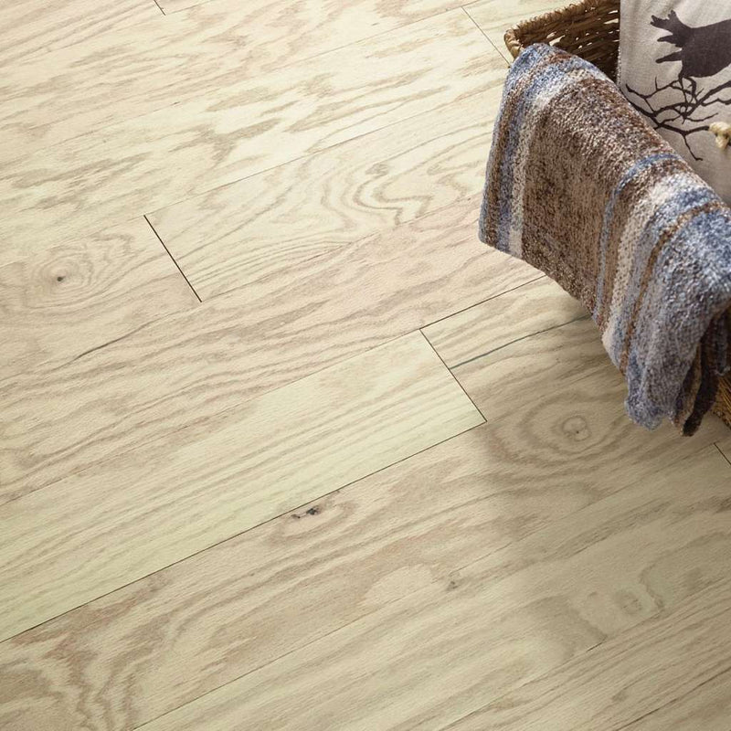 Eclectic Oak by Shaw Floors features the distinctive graining and detail of red oak hardwood. Pillowed edges and ends give each plank a more pronounced sculpted effect, which enhances the versatile vintage look.