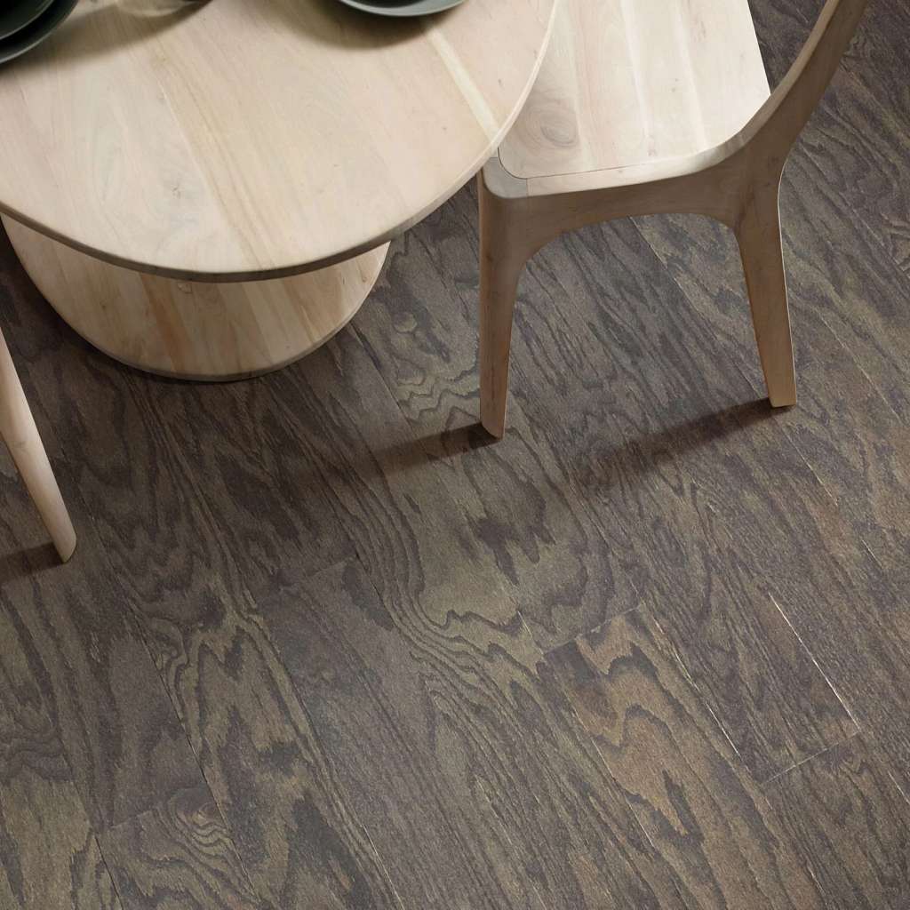 Eclectic Oak by Shaw Floors features the distinctive graining and detail of red oak hardwood. Pillowed edges and ends give each plank a more pronounced sculpted effect, which enhances the versatile vintage look.