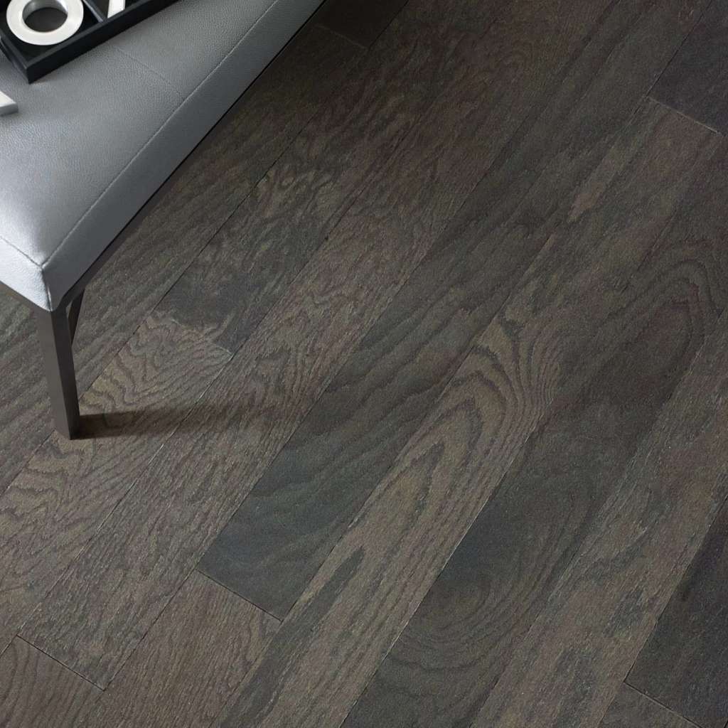 Eclectic Oak by Shaw Floors features the distinctive graining and detail of red oak hardwood. Pillowed edges and ends give each plank a more pronounced sculpted effect, which enhances the versatile vintage look.